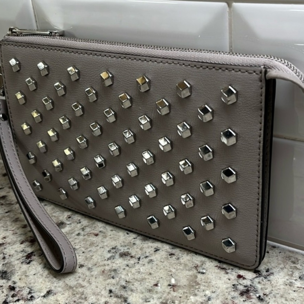 Michael Kors Authentic Silver Studded Wristlet. COA INCLUDED.